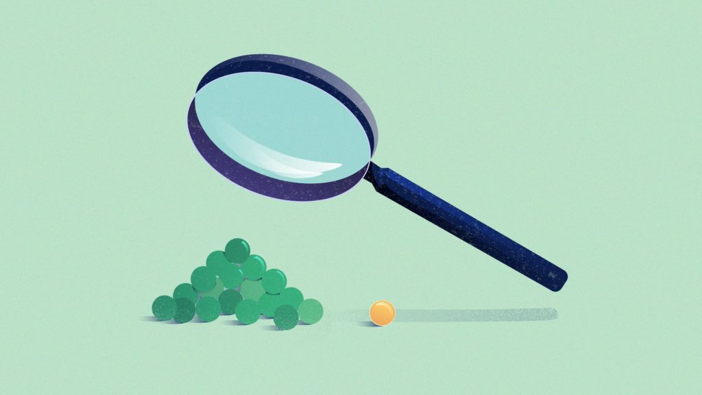 illustration of a magnifying glass over a stack of green marbles
